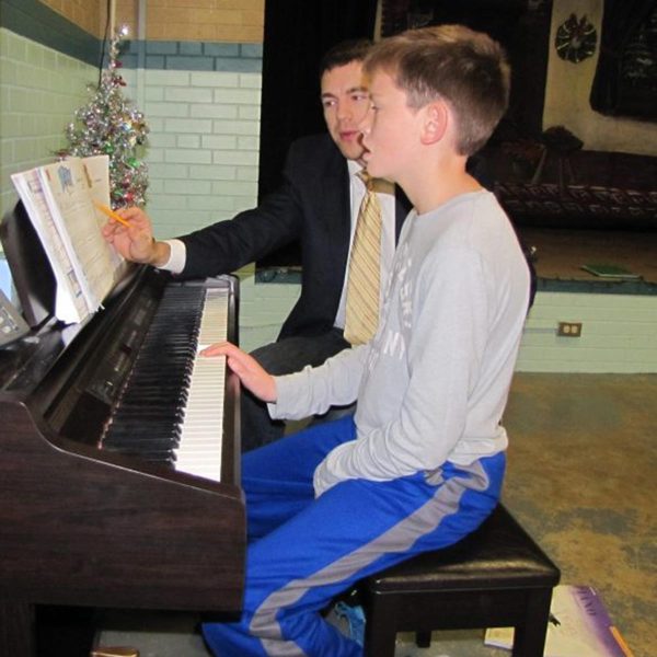 Enrichment piano student with teacher