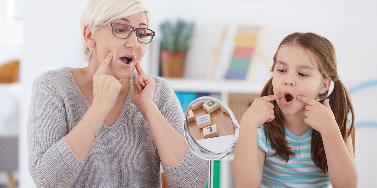 Speech therapist working with student