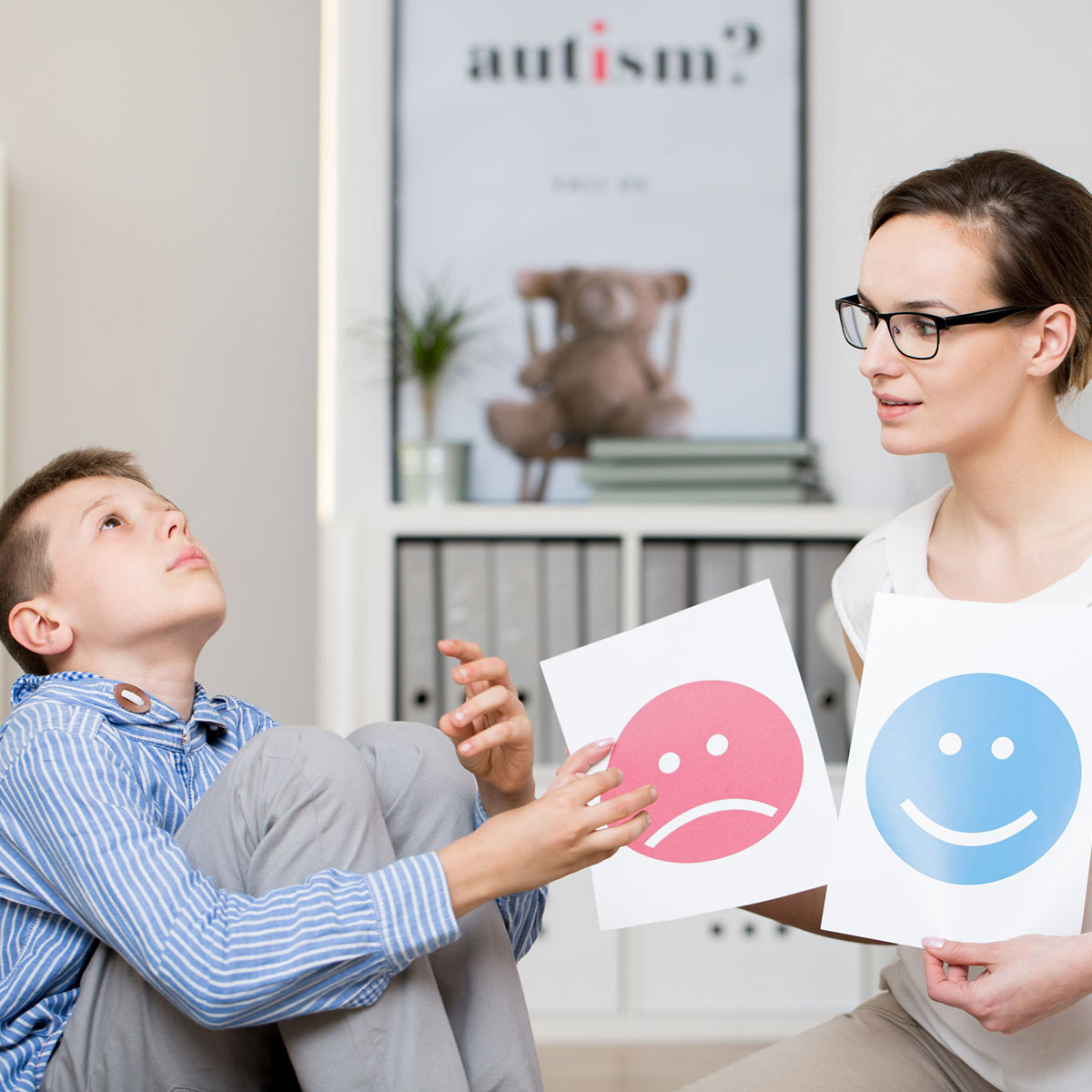 Behavioral therapist working with autistic student